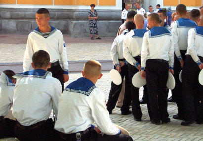 Group of cute young navy sailors in white uniform